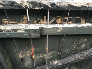 Waterblasting damage on wooden gate